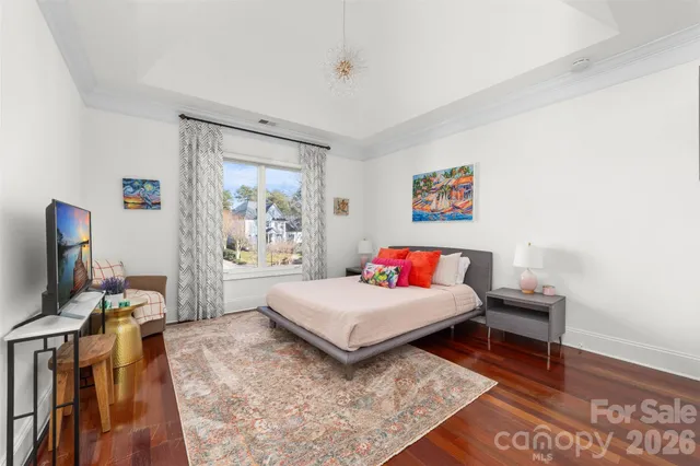 a living room with furniture a rug and a window