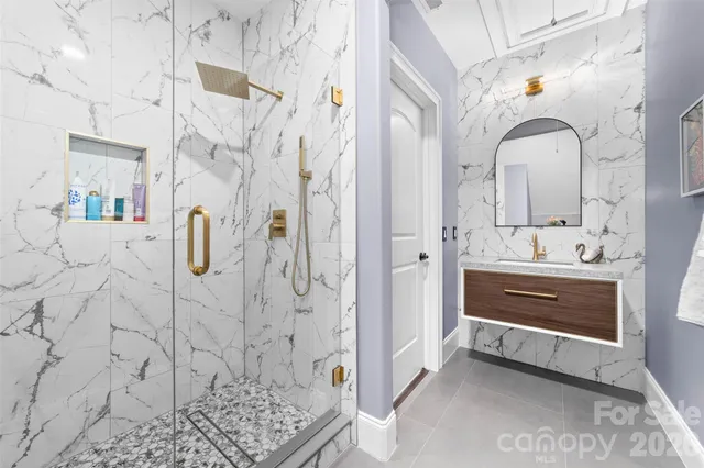 a balcony with furniture and a potted plant