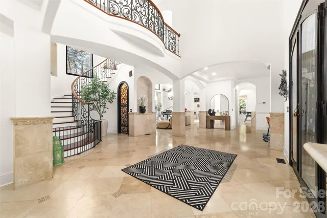 a view of living room with furniture and a fireplace