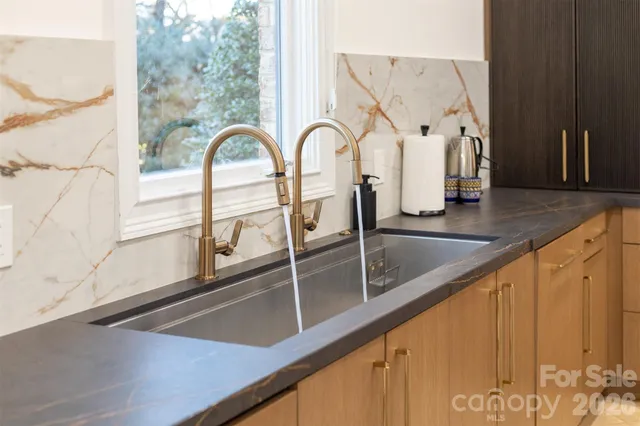 a living room with furniture a table and decor