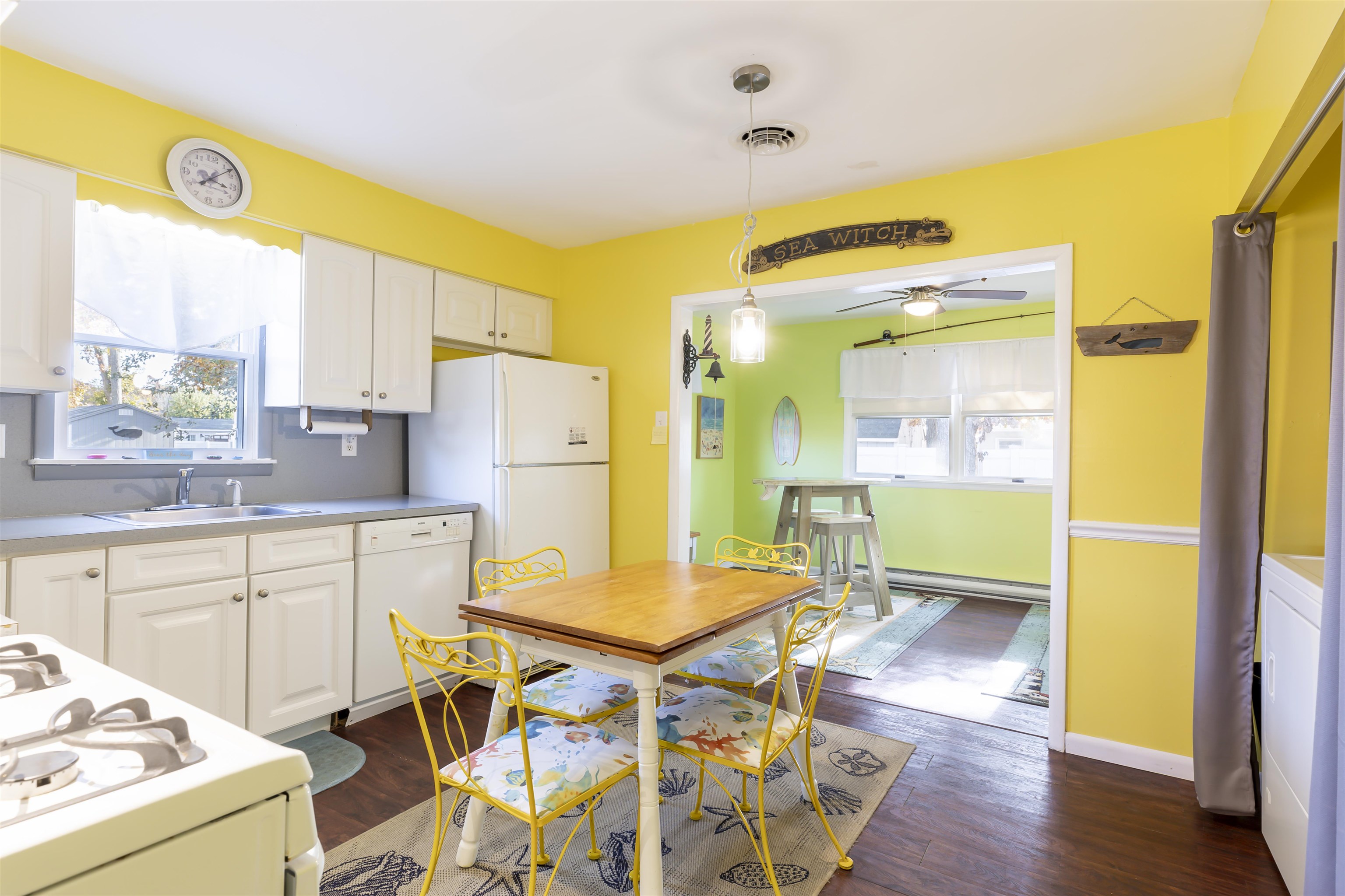 116 Cedardale Avenue Villas, NJ 08251 - Photo 10 of 30 a kitchen with a table chairs refrigerator and a sink