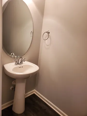 a bathroom with a sink and mirror