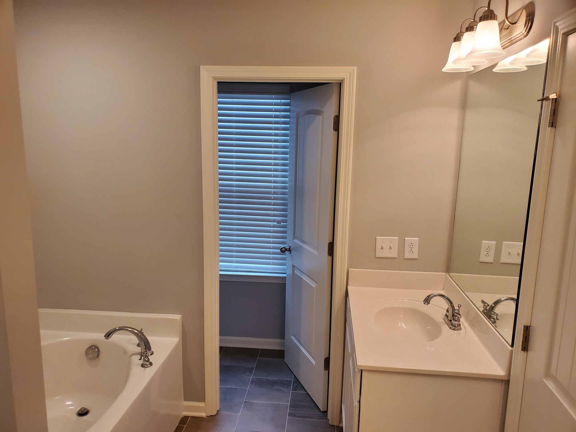 4417 Sunday Silence Way Murfreesboro, TN 37128 - Photo 15 of 17 a bathroom with a bathtub and sink