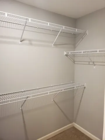 a view of a room with racks on the wall