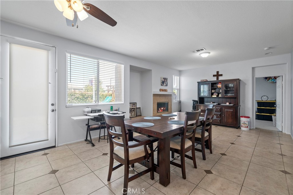 7441 Clementine Drive Eastvale, CA 92880 - Photo 14 of 39 a view of a dining room with furniture
