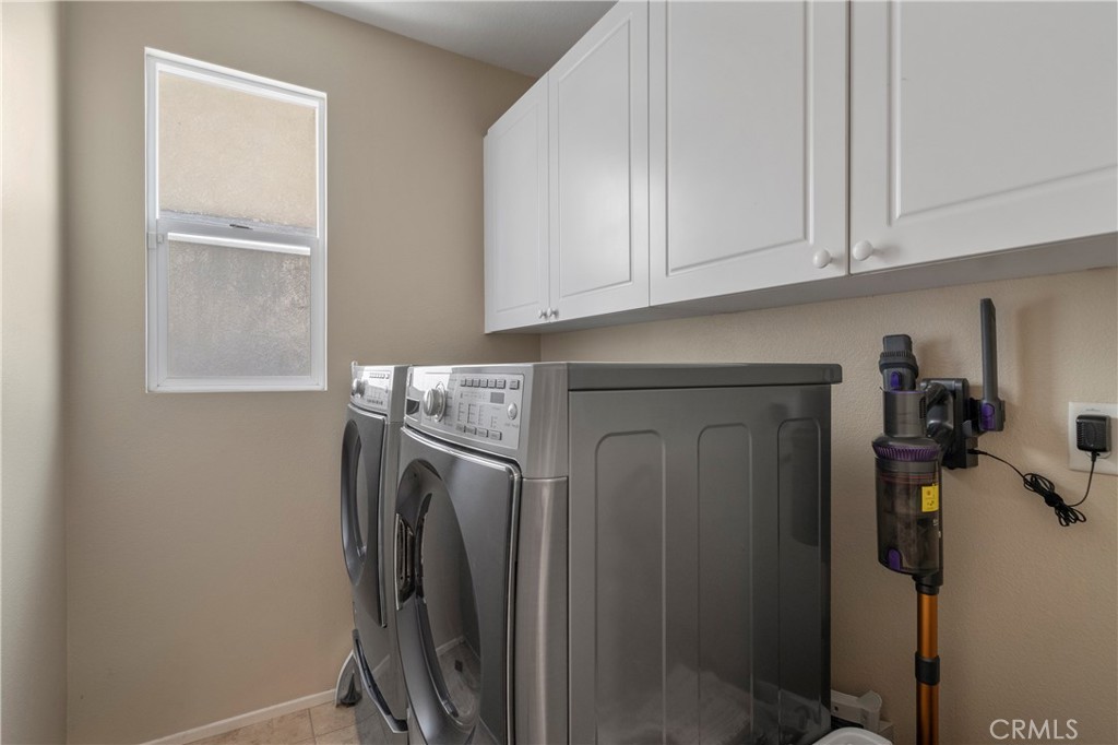 7441 Clementine Drive Eastvale, CA 92880 - Photo 18 of 39 a utility room with dryer and washer