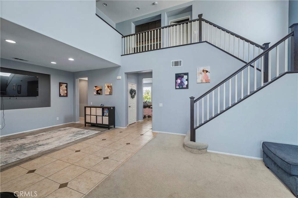 7441 Clementine Drive Eastvale, CA 92880 - Photo 3 of 39 a view of staircase with white walls