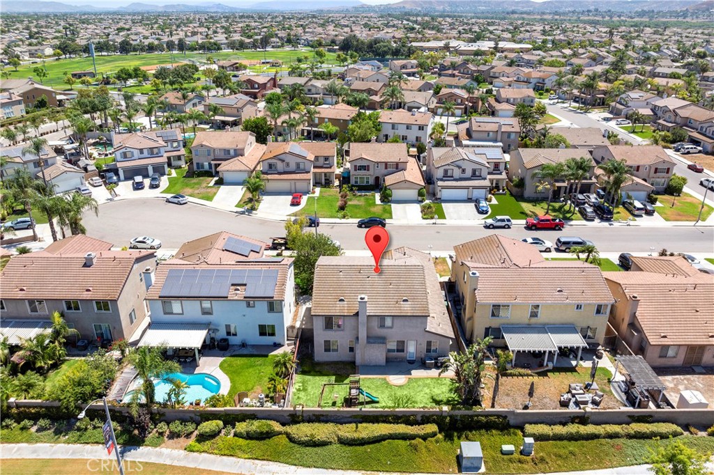 7441 Clementine Drive Eastvale, CA 92880 - Photo 35 of 39 an aerial view of a houses with a yard and lake view