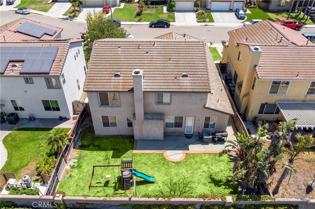 7441 Clementine Drive Eastvale, CA 92880 - Photo 36 of 39 a view of a house with backyard