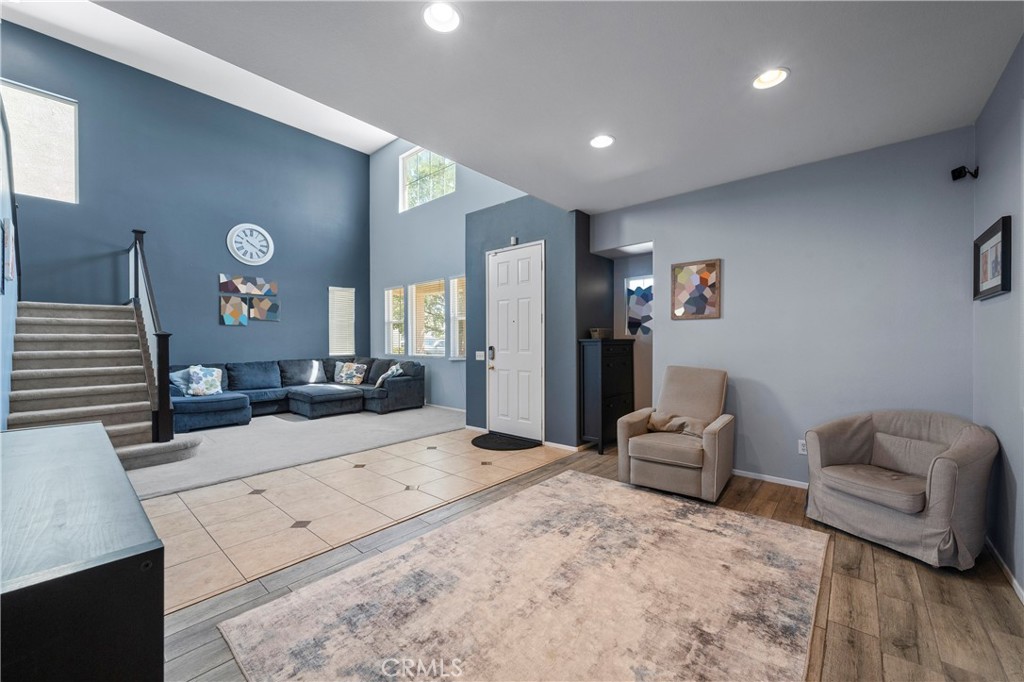 7441 Clementine Drive Eastvale, CA 92880 - Photo 9 of 39 a living room with furniture and a flat screen tv