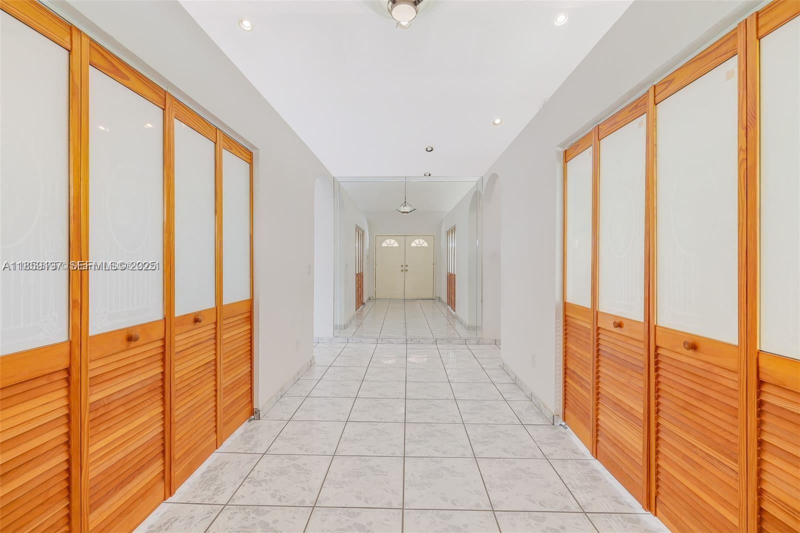 19900 Southwest 326th Street Homestead, FL 33030 - Photo 9 of 15 a hallway with a large window