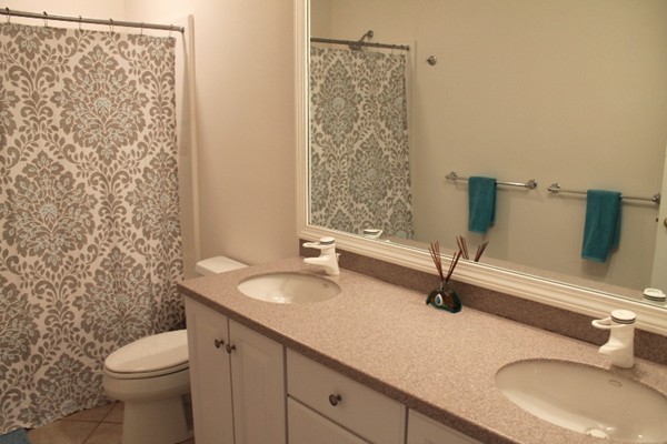 23 Wyman Road Lexington, MA 02420 - Photo 21 of 30 a bathroom with a granite countertop sink and a mirror