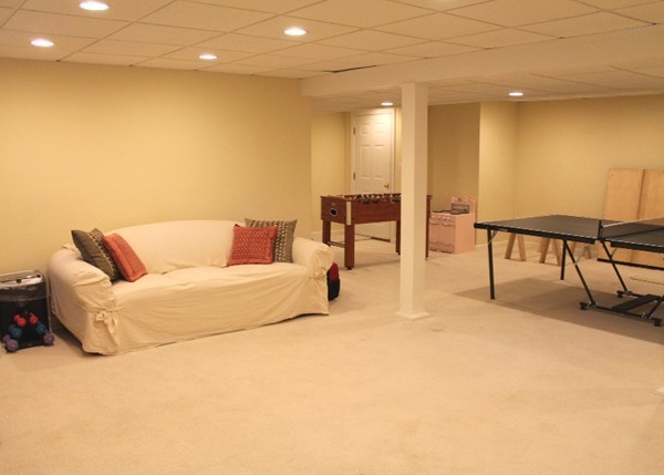 23 Wyman Road Lexington, MA 02420 - Photo 22 of 30 a living room with furniture and a flat screen tv
