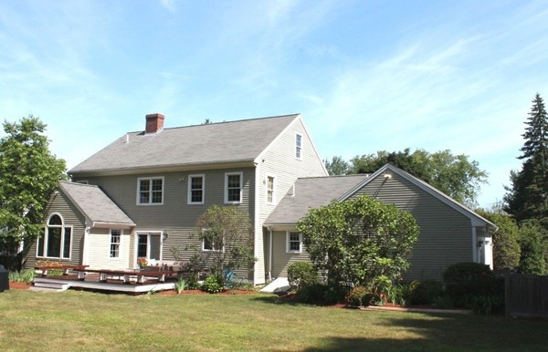 23 Wyman Road Lexington, MA 02420 - Photo 29 of 30 a front view of house with yard and trees in the background
