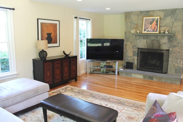 23 Wyman Road Lexington, MA 02420 - Photo 7 of 30 a living room with furniture and a flat screen tv