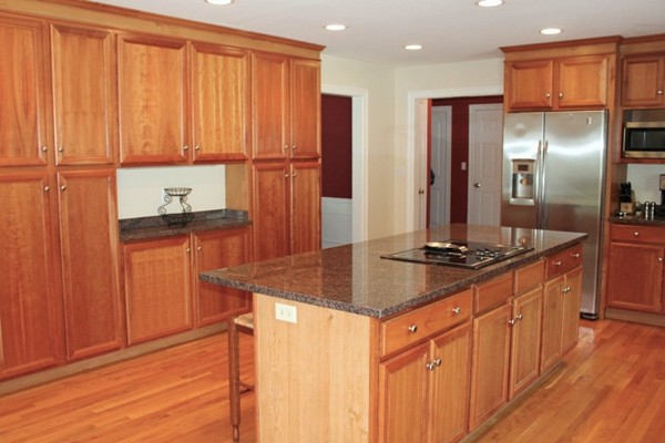 23 Wyman Road Lexington, MA 02420 - Photo 10 of 30 a kitchen with stainless steel appliances granite countertop a refrigerator and a sink