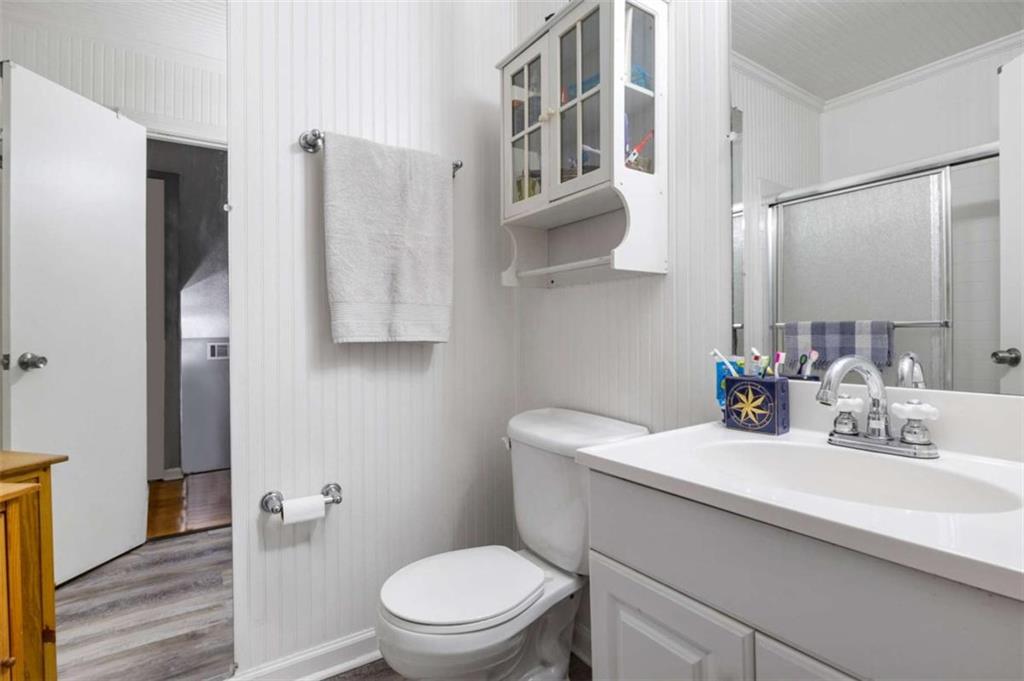 5948 Haywood Valley Road Summerville, GA 30747 - Photo 17 of 74 a bathroom with a sink a toilet and shower