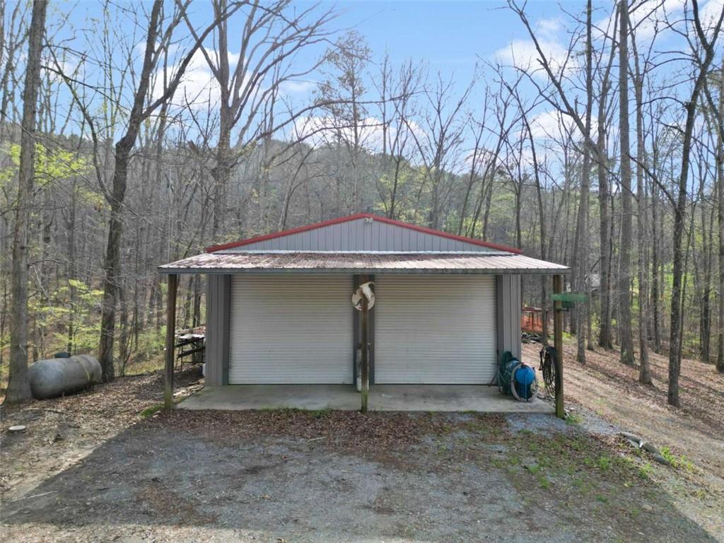 5948 Haywood Valley Road Summerville, GA 30747 - Photo 37 of 74 a front view of a house with a yard and garage