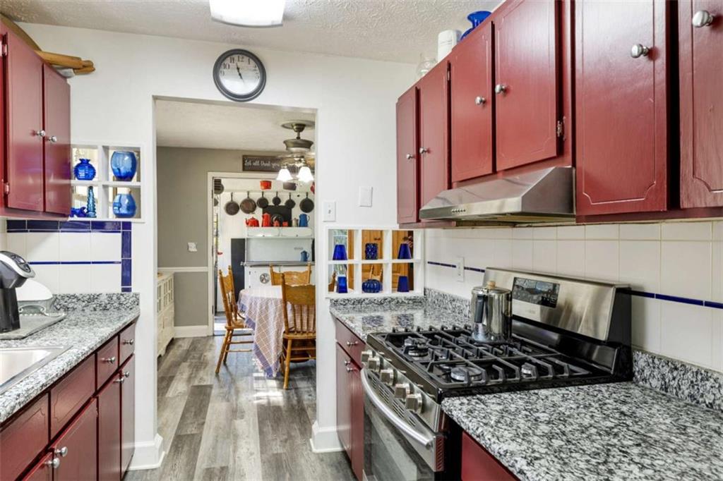 5948 Haywood Valley Road Summerville, GA 30747 - Photo 6 of 74 a kitchen with stainless steel appliances granite countertop a stove and cabinets