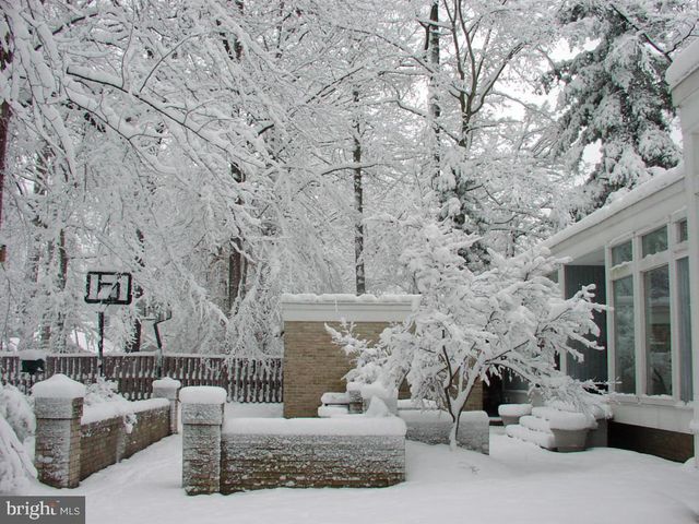 a view of a patio with couches and table and chairs