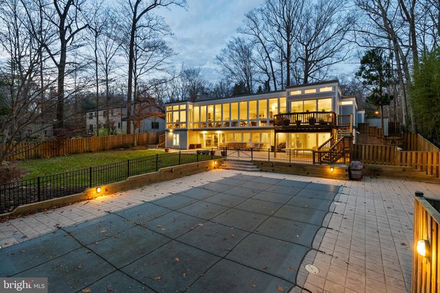 a view of swimming pool with an outdoor seating
