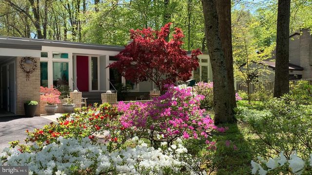 a front view of a house having fountain