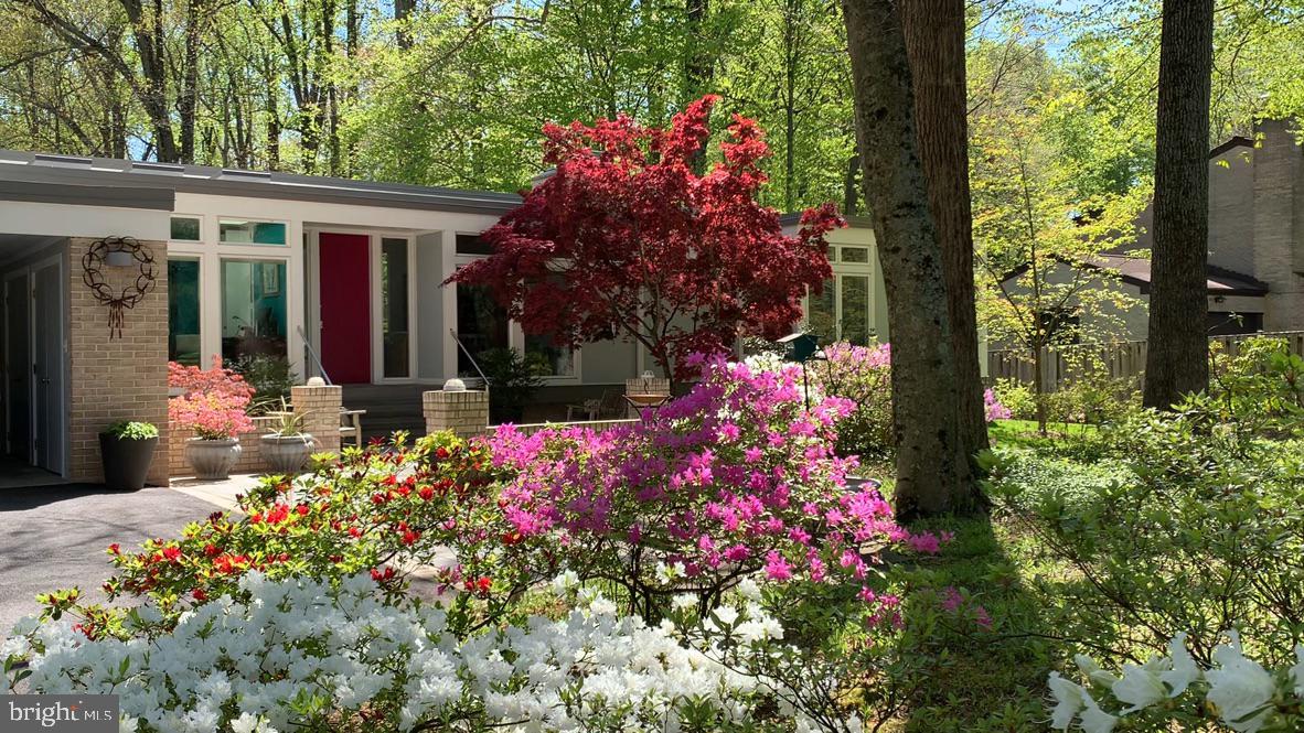 6904 Carmichael Avenue Bethesda, MD 20817 - Photo 8 of 16 a front view of a house having fountain