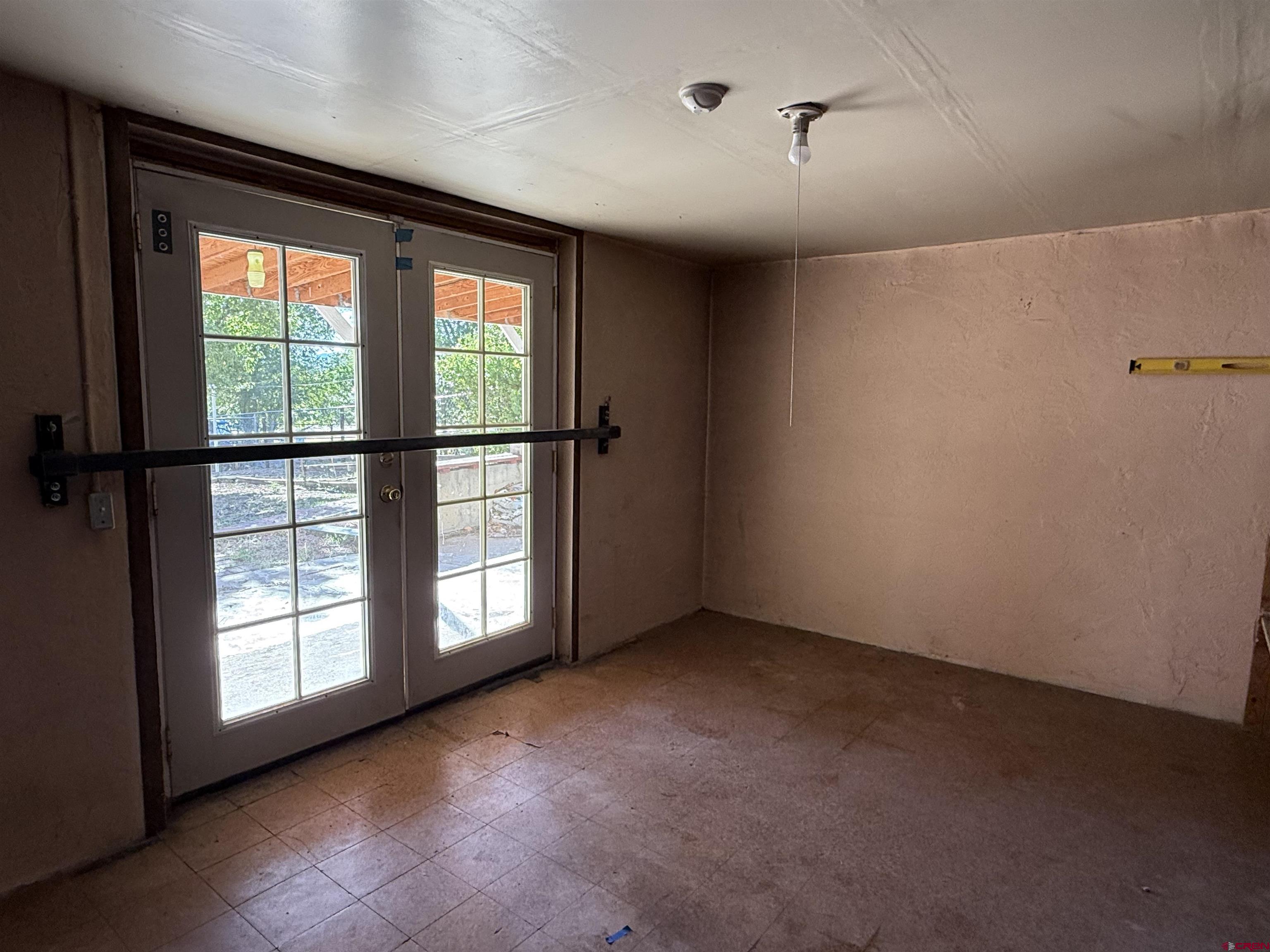 418 South Valley Road Cortez, CO 81321 - Photo 18 of 32 a view of an empty room with a window