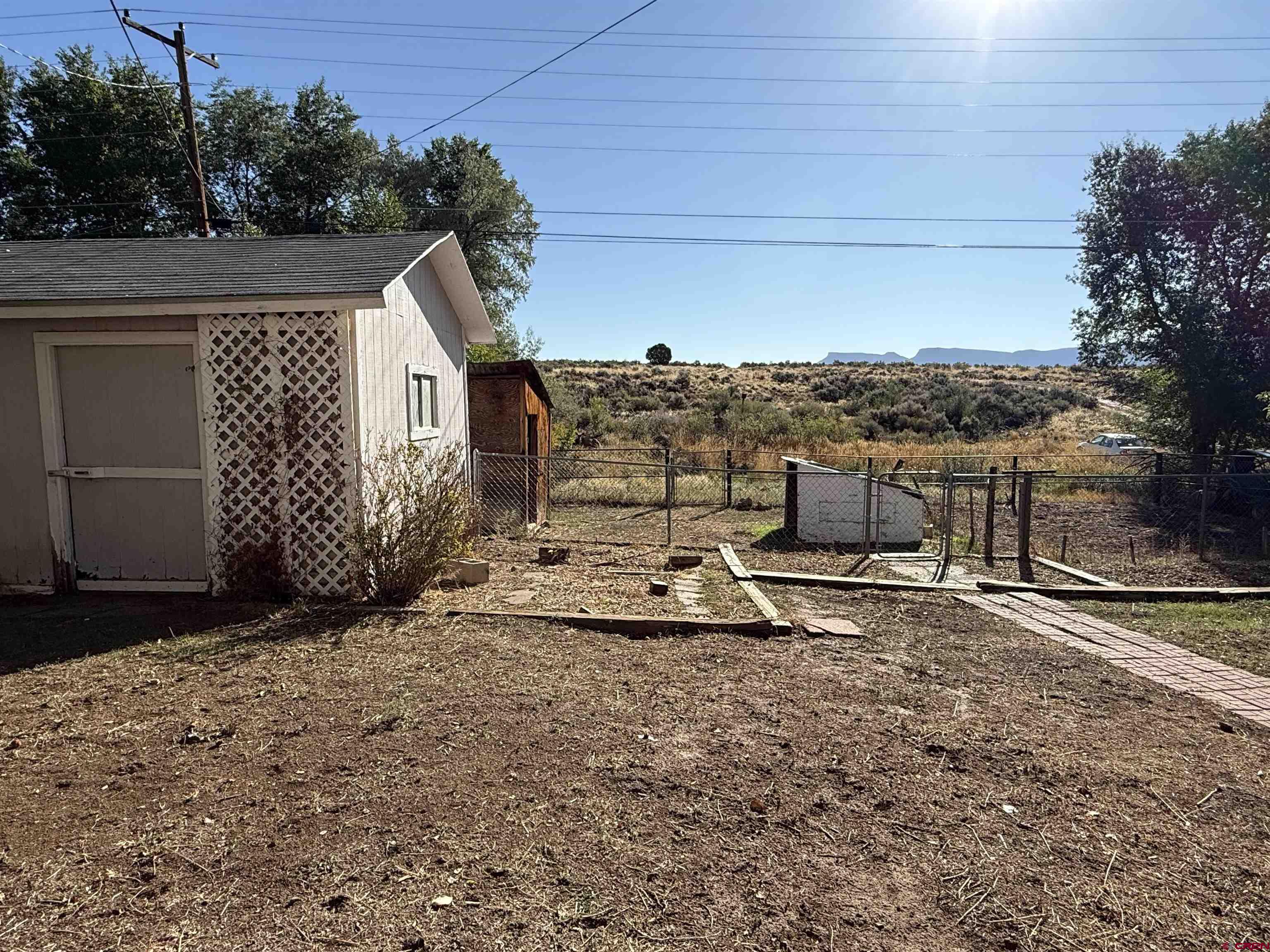 418 South Valley Road Cortez, CO 81321 - Photo 22 of 32 a view of a terrace with a bench
