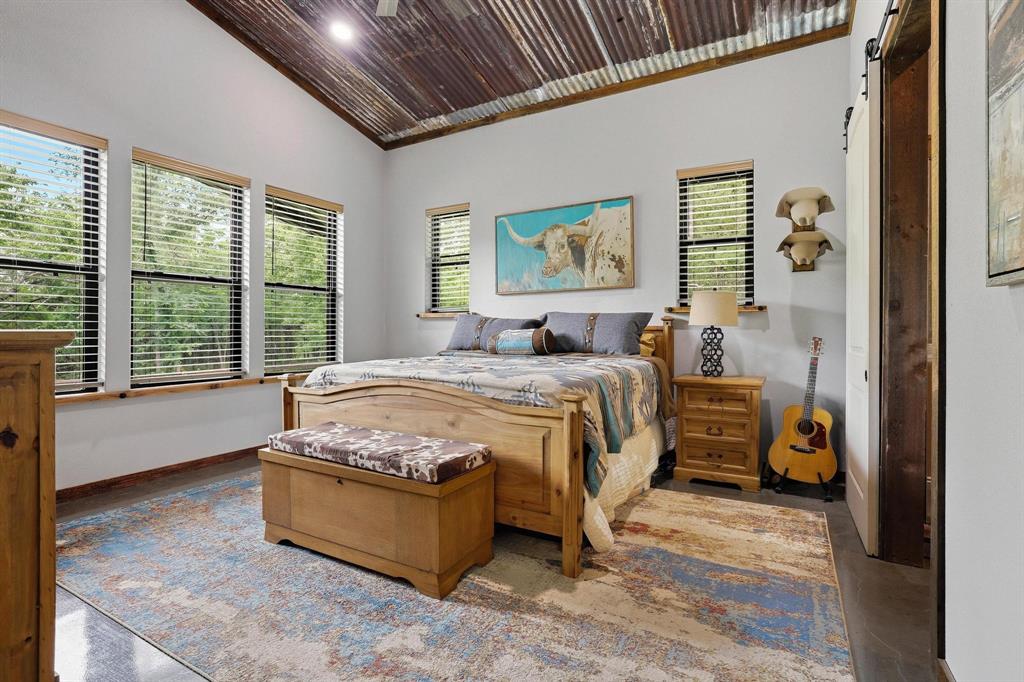 1900 County Road 1535 Bonham, TX 75418 - Photo 17 of 37 a spacious bedroom with a bed and a window