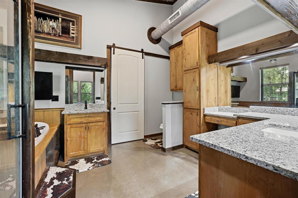 1900 County Road 1535 Bonham, TX 75418 - Photo 20 of 37 a kitchen with stainless steel appliances granite countertop a refrigerator and a stove