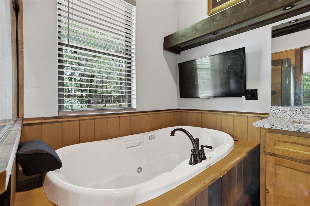 1900 County Road 1535 Bonham, TX 75418 - Photo 23 of 37 a bathroom with a bathtub and a window