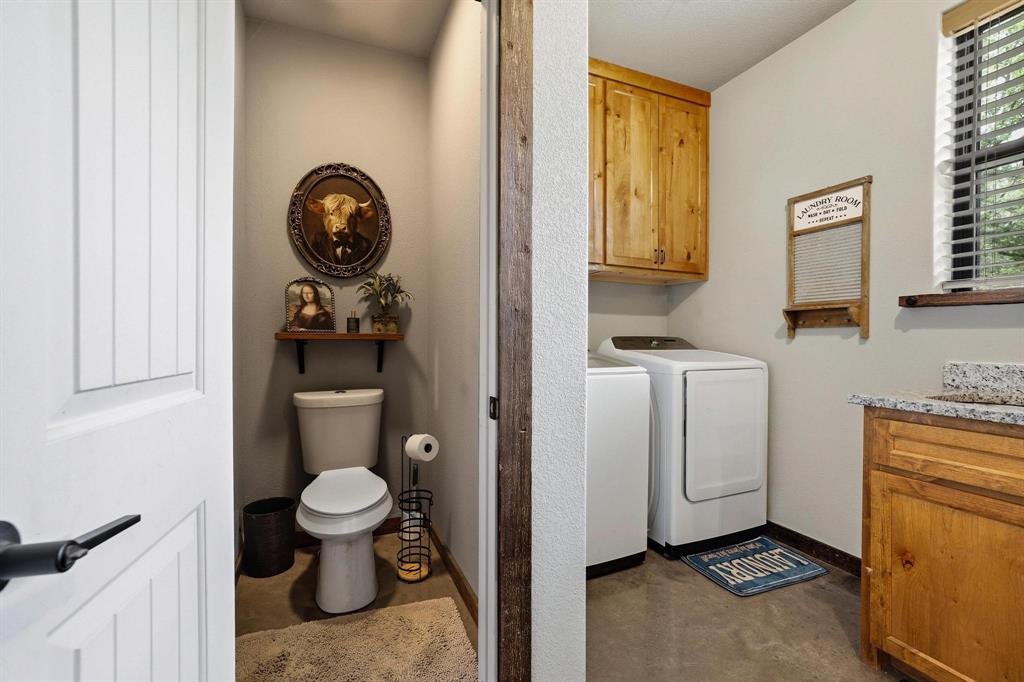 1900 County Road 1535 Bonham, TX 75418 - Photo 25 of 37 a bathroom with a toilet and a sink
