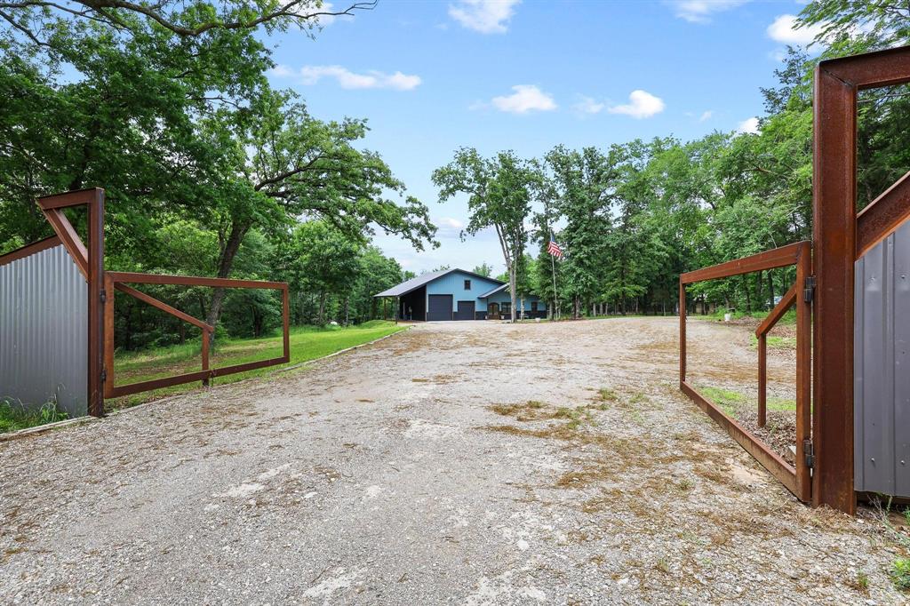 1900 County Road 1535 Bonham, TX 75418 - Photo 3 of 37 a view of a backyard with large tree