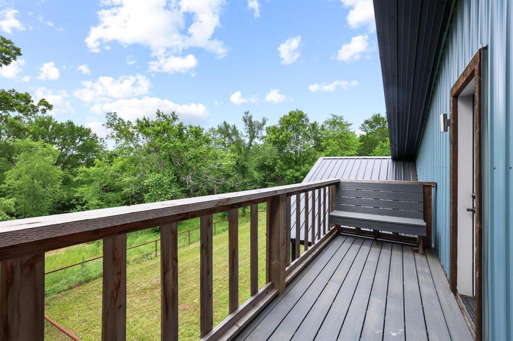 1900 County Road 1535 Bonham, TX 75418 - Photo 35 of 37 a view of balcony with wooden floor and fence