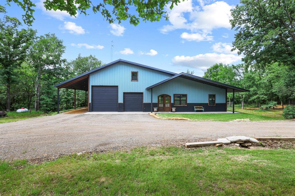 1900 County Road 1535 Bonham, TX 75418 - Photo 4 of 37 a house with swimming pool in front of it