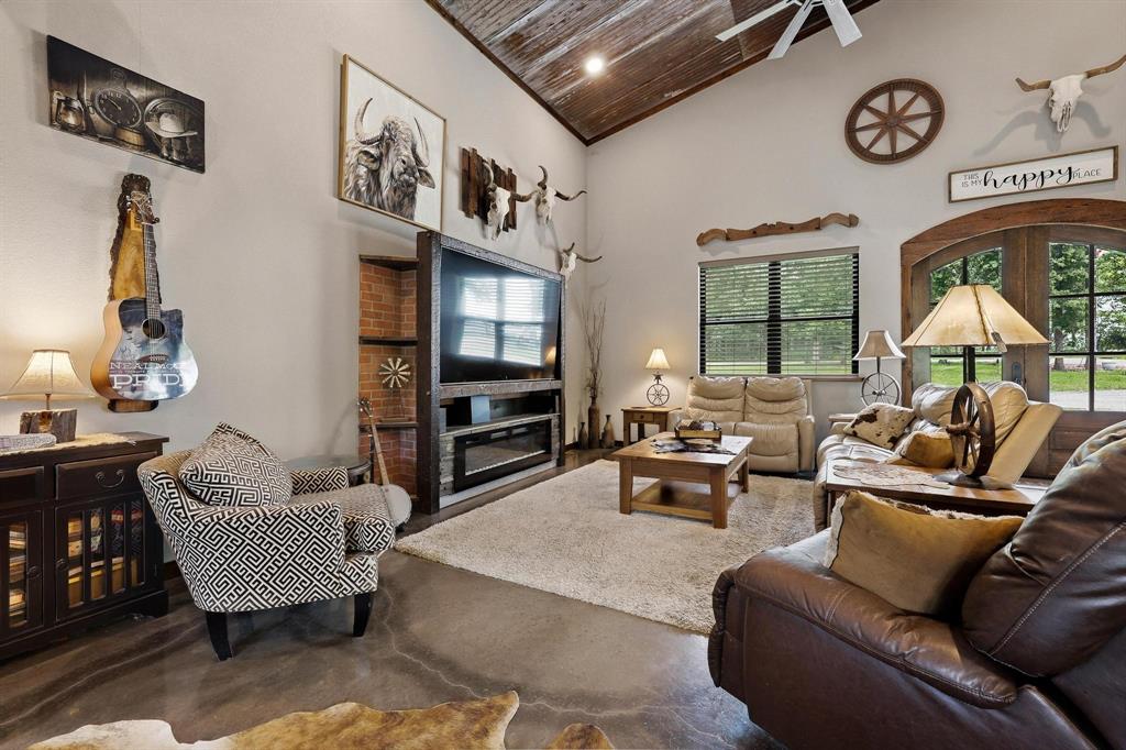 1900 County Road 1535 Bonham, TX 75418 - Photo 8 of 37 a living room with furniture ceiling fan and a window