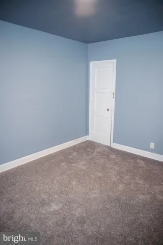 a view of an empty room and entryway