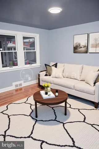 a living room with furniture and window