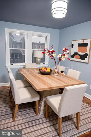 a view of a dining room with furniture and a table
