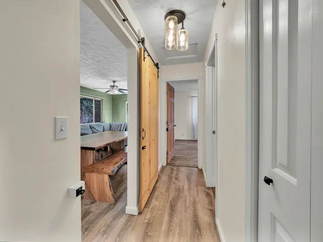 walk in closet with wooden floor
