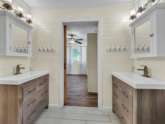 a bathroom with a shower and a sink