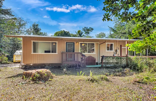 a house view with a backyard space