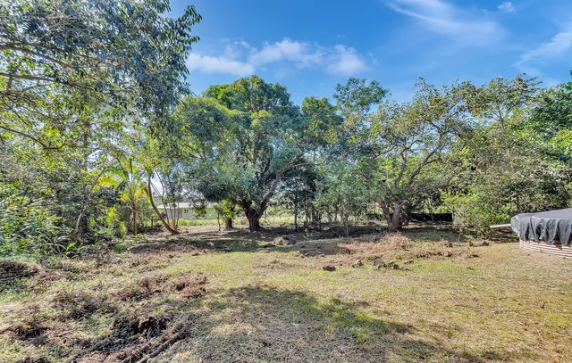 a bathroom with a tub sink and shower