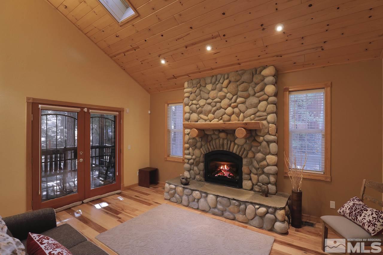 276 Chimney Rock Road Stateline, NV 89449 - Photo 3 of 25 a living room with furniture and a fireplace