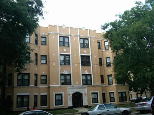 2034 West Arthur Avenue, Unit 3 Chicago, IL 60645 - Photo 1 of 1 a front view of a residential apartment building with a yard