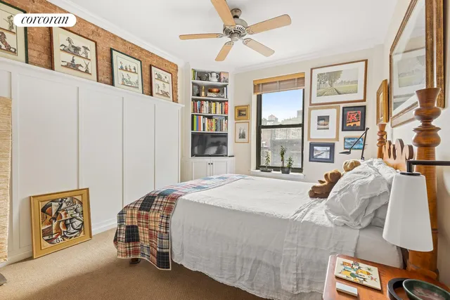 a bedroom with a large bed and a window