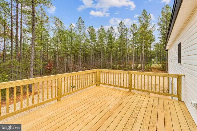 a bathroom with a sink and a yard covered with snow in the front