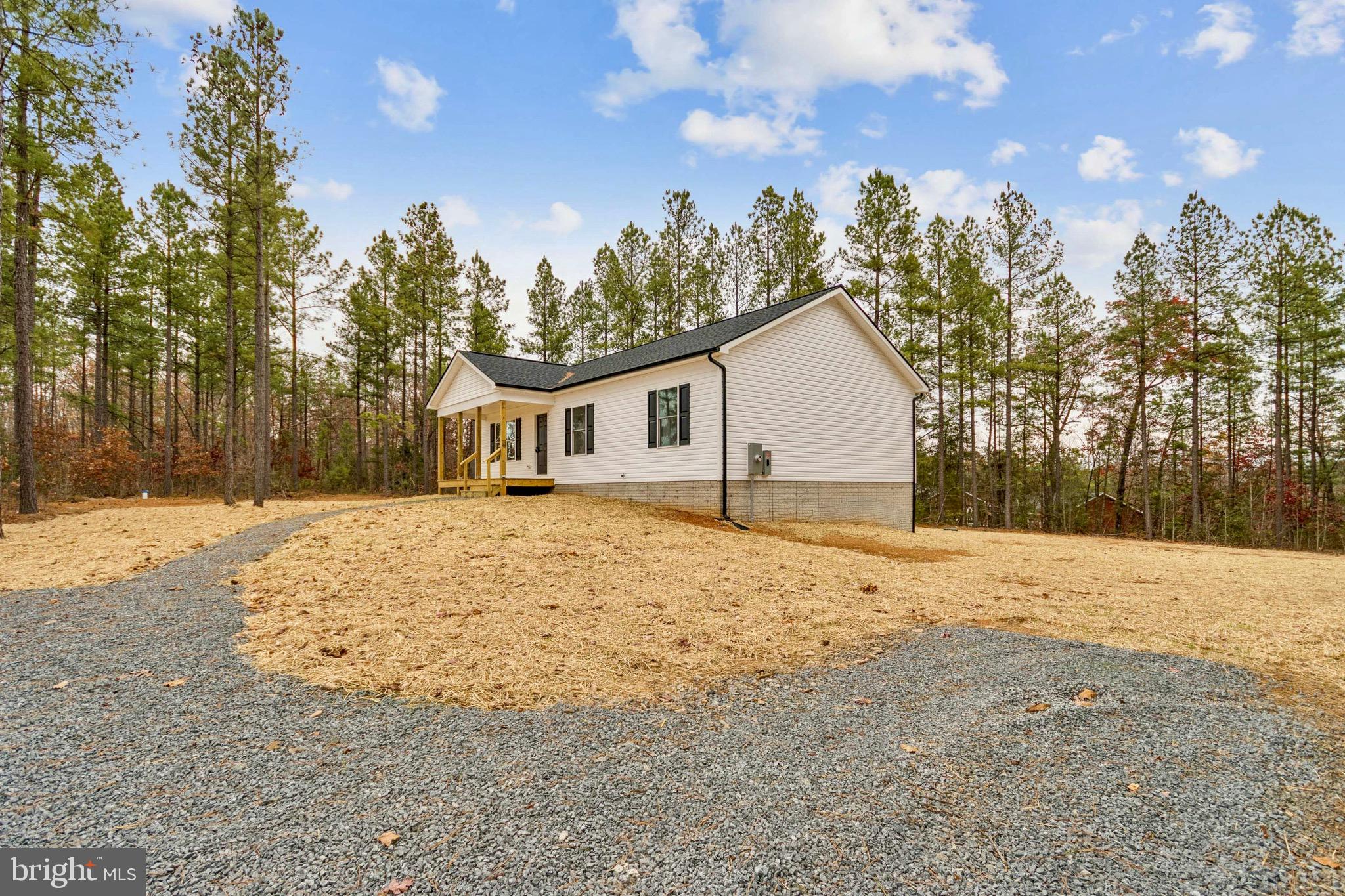 15281 Shirley Road Unionville, VA 22567 - Photo 24 of 24 a house with trees in the background