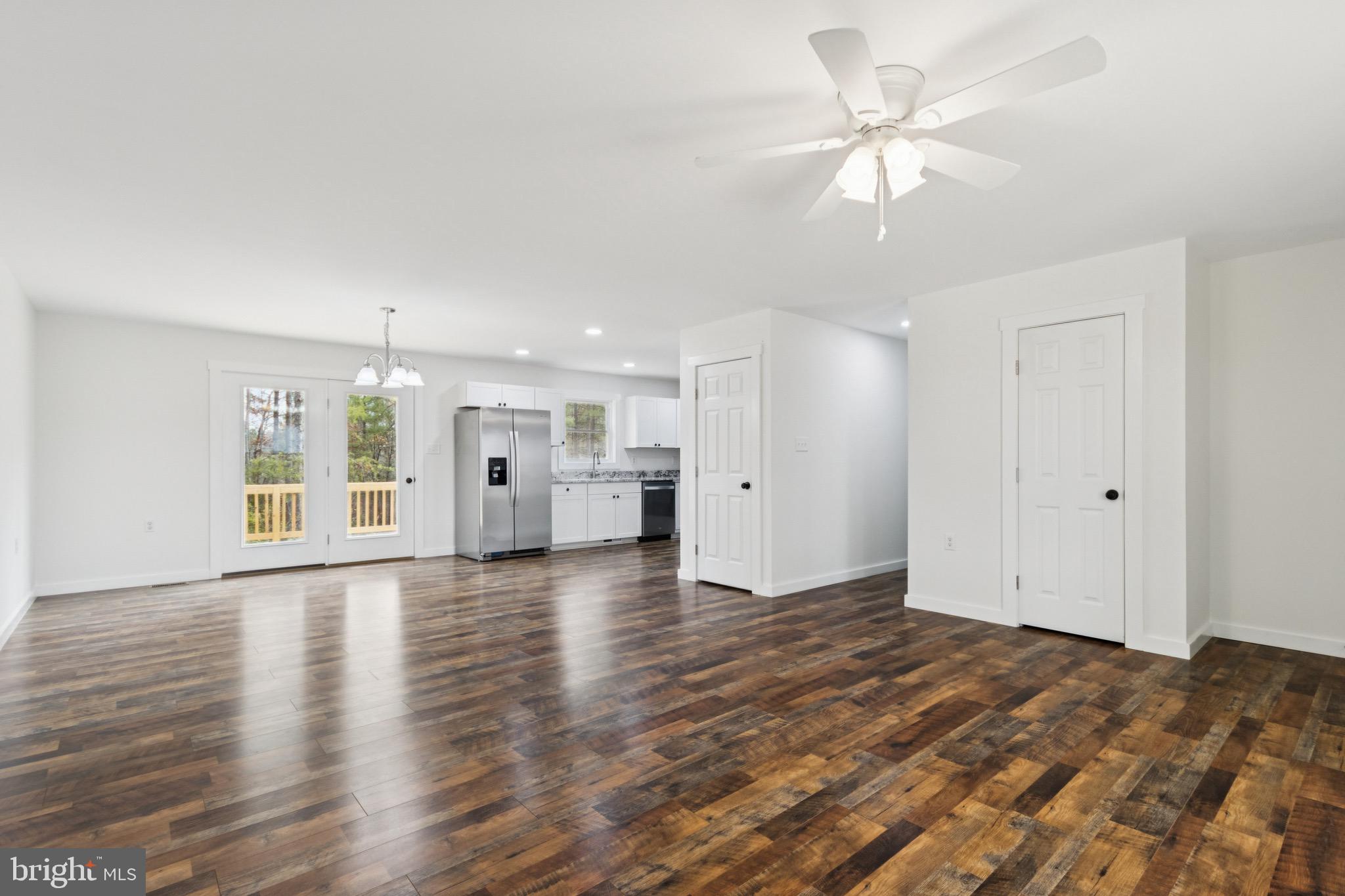 15281 Shirley Road Unionville, VA 22567 - Photo 4 of 24 a view of an empty room with window and wooden floor